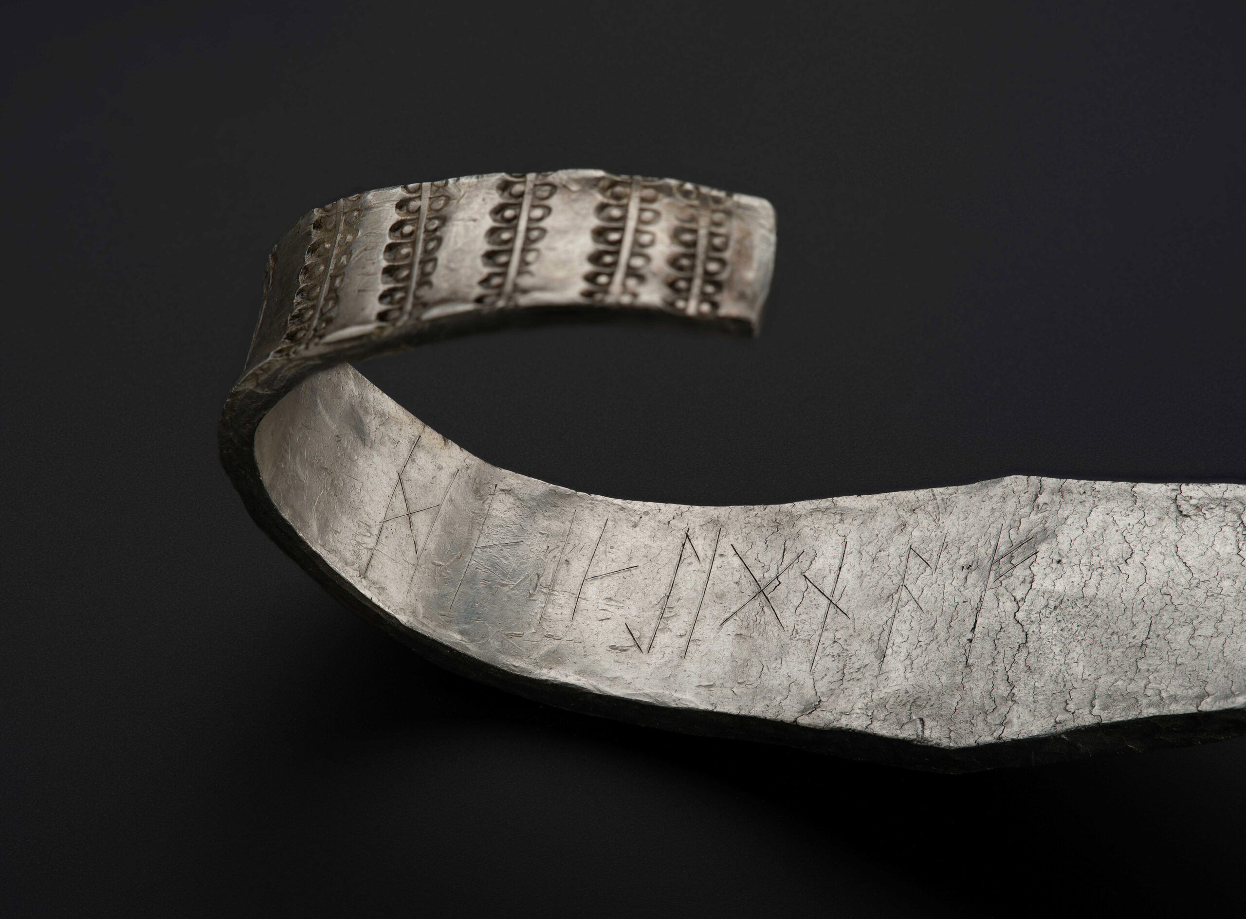 Galloway Hoard arm ring with runic inscription in view. Photo: © National Museums Scotland.
